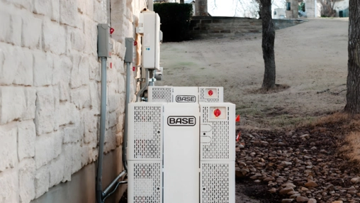 Battery storage units installed beside commercial building for EV charging infrastructure